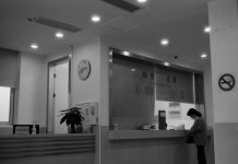 Workplace Safety Audits: What Inspectors Really Look For a black and white photo of a woman standing in front of a counter