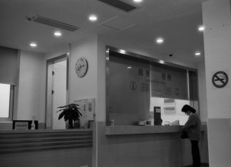 Workplace Safety Audits: What Inspectors Really Look For a black and white photo of a woman standing in front of a counter