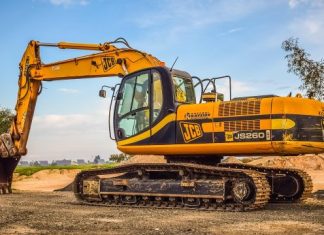 What Criteria Should You Use to Select Heavy Equipment Transport Providers machine, heavy, scoop, industry, equipment, excavator, heavy machine, vehicle, machinery, yellow, brown industry, excavator, excavator, excavator, excavator, excavator