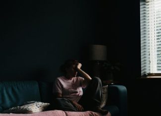 Breaking the Silence: How Talking to Someone Can Diminish Your Feelings of Isolation a person sitting on a couch
