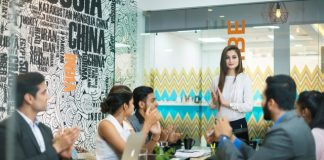 men and women having a meeting