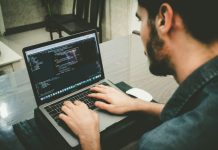 Build Your Dream App with the Right Developer in Melbourne man programming using laptop