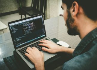 Build Your Dream App with the Right Developer in Melbourne man programming using laptop