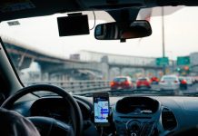 Eyes Off the Road: Common Causes of Driver Distraction man driving vehicle with GPS system turned on