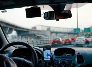 Eyes Off the Road: Common Causes of Driver Distraction man driving vehicle with GPS system turned on