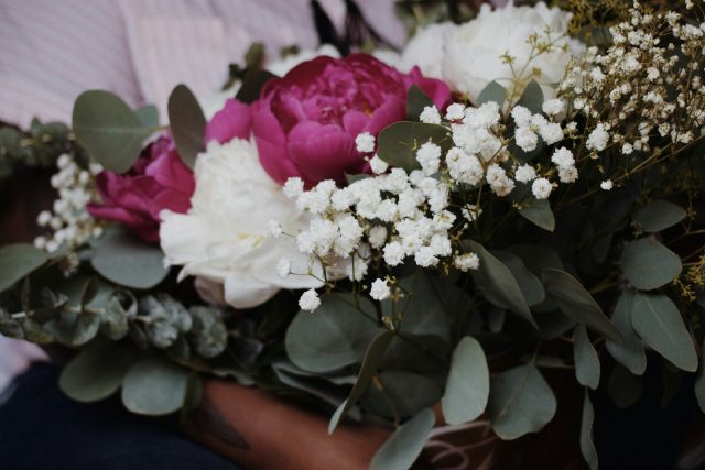 Photo by Jazmin Quaynor a bouquet of white and pink flowers and greenery