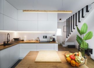 The Pros and Cons of Smart Home Rentals A kitchen with a wooden counter top next to a plant