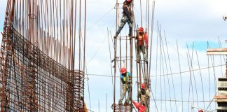 people working on building during daytime