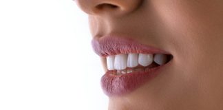 a close up of a woman's mouth with white teeth