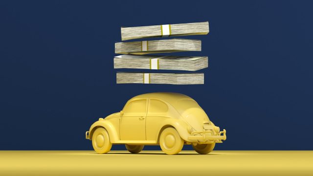 Photo by Mehdi Mirzaie a yellow car with stacks of money on top of it