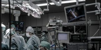 people wearing surgical clothes inside operating room