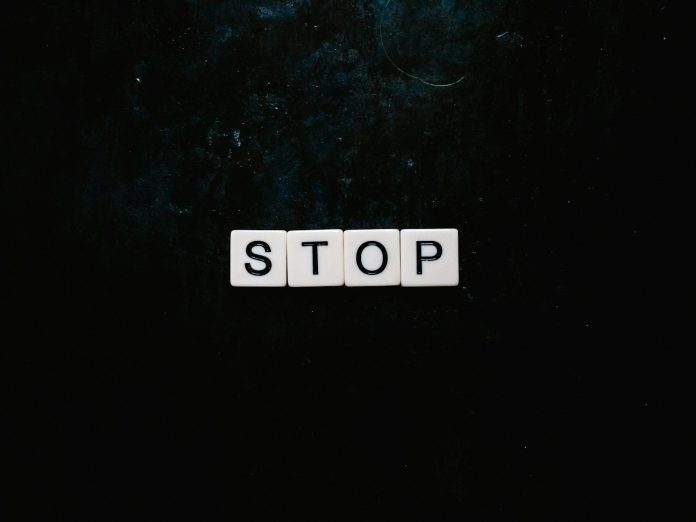 Photo by Sincerely Media stop text with black background