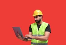 A Strategic Guide to Choosing the Right MS4 Inspection Software a man in a yellow hard hat holding a tablet