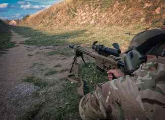 How Do Law Enforcement Agencies Benefit from Custom-Built Shooting Ranges? a motorcycle that is sitting on the side of a mountain