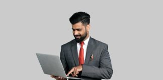 a man holding a laptop
