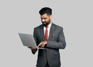 The Role of Technology in Streamlining Legal Hold Management and Tracking a man holding a laptop