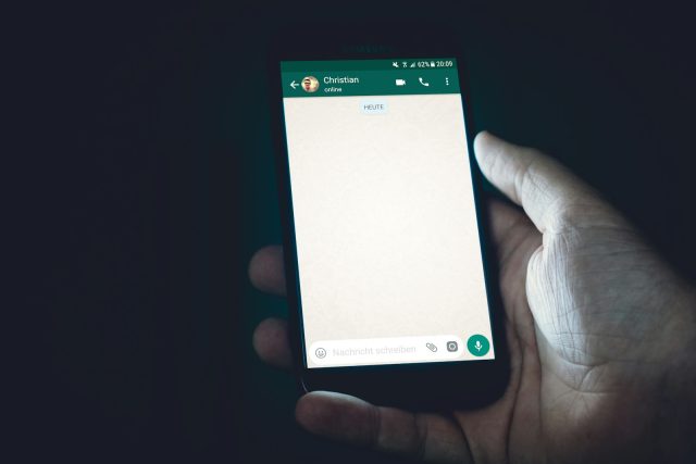 Photo by Christian Wiediger person holding smartphone