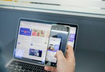 The Role of Digital Platforms in Shaping the Future of Business a person holding a cell phone and a laptop