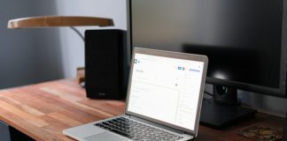 macbook pro on brown wooden table
