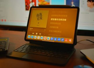a laptop computer sitting on top of a wooden desk