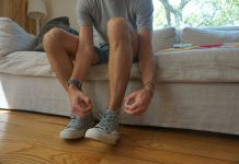 The Secret to Healthy Legs Many in Brooklyn Don’t Know About a man sitting on a couch holding his shoes