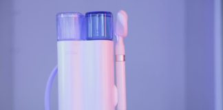 a toothbrush and a toothpaste holder on a table