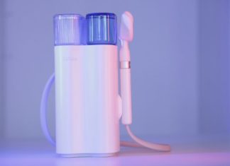 Integrating Brown’s Gas with Modern Wellness Rituals a toothbrush and a toothpaste holder on a table
