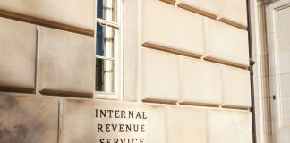 A close up of a building with a sign on it