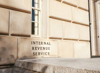 What Are the IRS Limits for 401(k) Contributions in 2025? A close up of a building with a sign on it