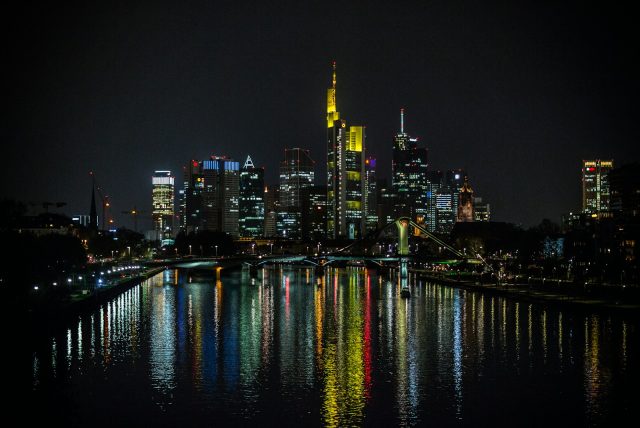 Photo by Rüdiger Chmielus city skyline during night time