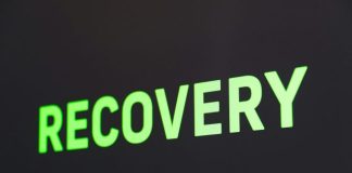 a close up of a sign that reads recovery
