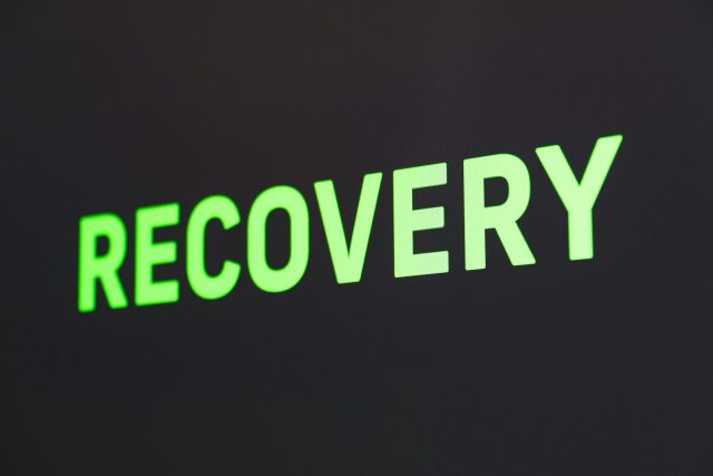 Photo by Martin Sanchez a close up of a sign that reads recovery