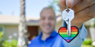 selective photo of gray key with heart key chain