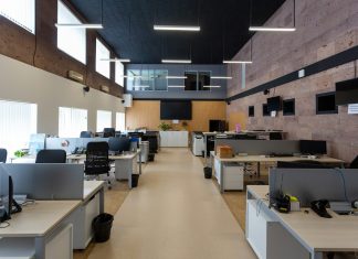 black flat screen computer monitor on white wooden desk