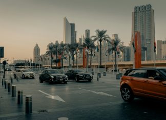 cars on road near buildings during daytime