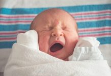 How Much Should a 2 Week Old Eat? A Complete Guide for New Parents baby yawning