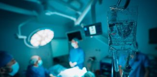 a group of surgeons in a hospital operating room