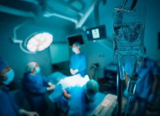 How Much Does a Medical Malpractice Lawyer Cost in New York? a group of surgeons in a hospital operating room