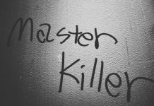 How Murder Mystery Events Compare to Escape Rooms and Game Nights a black and white photo of a wall with writing on it