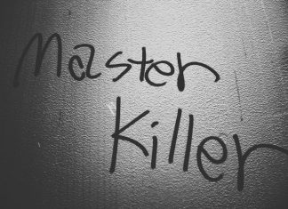 How Murder Mystery Events Compare to Escape Rooms and Game Nights a black and white photo of a wall with writing on it