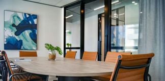 brown wooden 9-piece office table and chairs