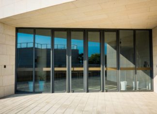 How Do the Features of Bifold Iron Doors Improve Home Aesthetics and Usability?