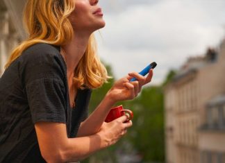 SnagVape: The European Vape Shop Online That Won’t Break the Bank a woman holding a cup and a cell phone