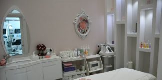 white wooden vanity table with mirror