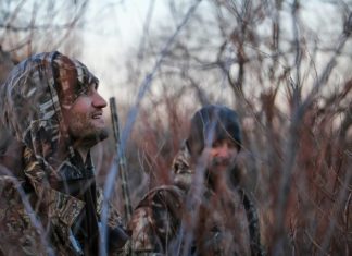 Three Commonly Forgotten Items When Packing for a Hunting Trip two men's inside forest