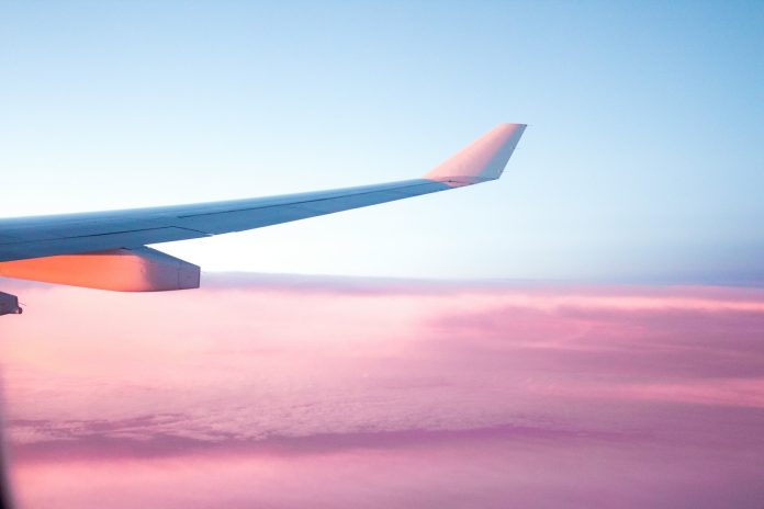 Photo by S O C I A L . C U T aerial view of airplane wing