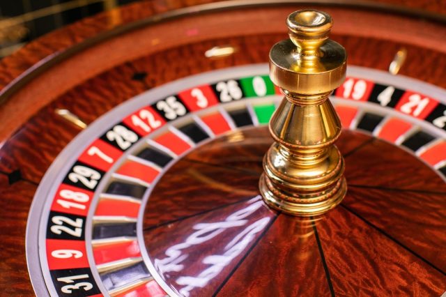 a-roulette-wheel-with-a-gold-ball-on-top-ai-gener A roulette wheel with a gold ball on top AI-generated content may be incorrect.