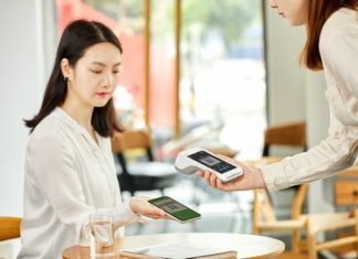 How Southeast Asia Pays Online — and What You Need to Offer at Checkout woman in white long sleeve shirt holding white smartphone