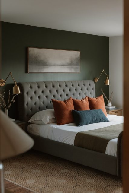 Photo by Clay Banks A modern bedroom with a tufted headboard and art.