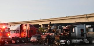 a bunch of trucks that are parked in a lot